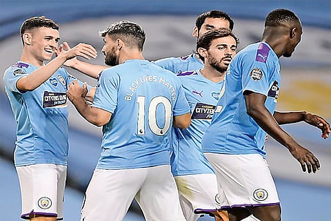 Manchester City players celebrate their win over Burnley