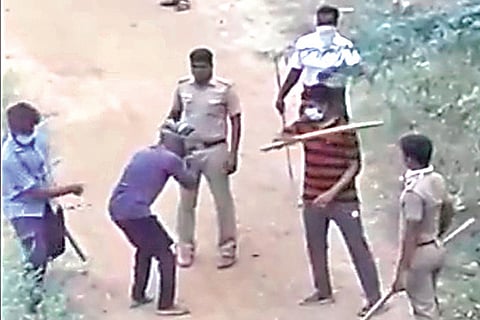 Screengrab of officials assaulting a man in Minjur