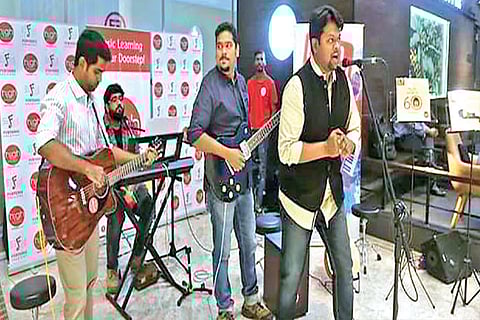 Mahesh Jayaraman singing during an event