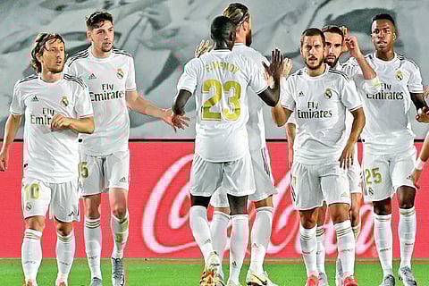 Real Madrid players celebrate their 2-0 win over Mallorca