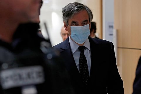 French court convicts former PM Fillon of embezzling public funds