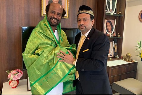 Tamil Nadu Hajj Committee Chairman Abu Backer presenting a shawl to Rajinikanth in Chennai