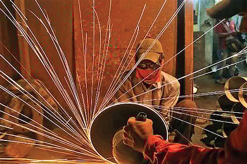 Weak demand slows factory growth in Feb: PMI