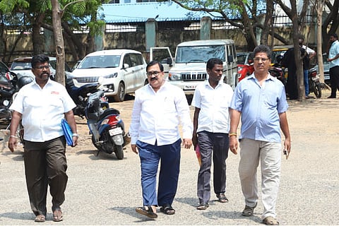 AIADMK MP KN Ramachandran with his son and the bank manager at the Special Court on Wednesday