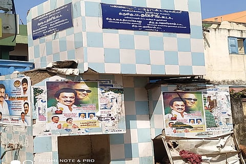 Posters stuck on the walls of the water unit at Venkatraman Nagar
