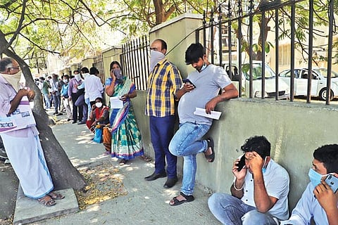 There are at least 1,000 people waiting outside the commissionerate to apply for travel pass