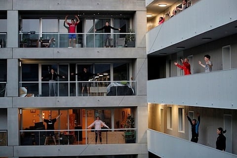 Beating lockdown inertia: French city-dwellers keep fit on balconies