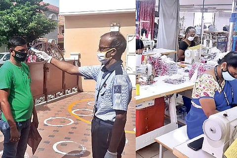 A guard checking temperature of workers, employees wearing masks and maintaining social distance