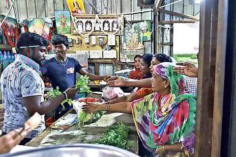 Customers crowded in a grocery shop at Muttukadu
