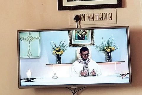 A sermon aired on a TV channel at a house in the city