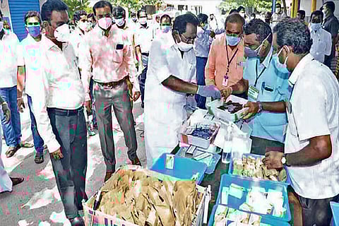 Minister Sellur K Raju distributing zinc, vitamin C and other health tonics to increase immunity