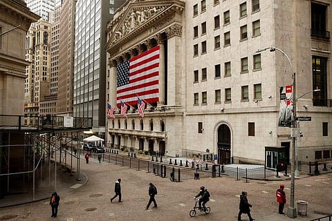 File Photo: Morning commuters are seen on Wall St. outside the New York Stock Exchange (Reuters)
