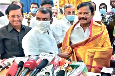 Dalit leader VP Duraisamy being welcomed into BJP by the party?s state unit president L Murugan