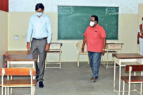 Tirupur Collector K Vijayakarthikeyan inspecting a Class 12 public exam valuation centre in the dist