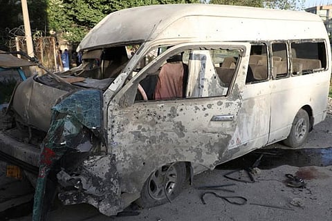A wreckage of a bus which carried employees of an Afghan television station