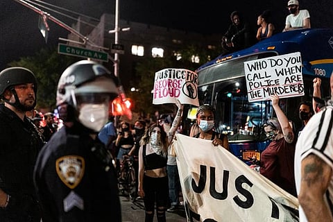 Protests over police killings rage in dozens of US cities