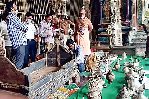 HR and CE officials inspecting the palanquin at the Kanchi temple