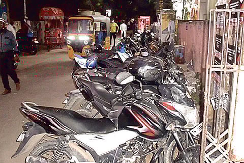 Bike parked in front of a gate in T Nagar