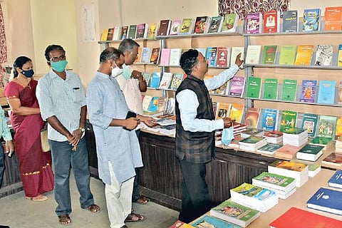 People browsing through books at the fair
