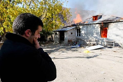 Armenians torch their homes on land ceded to Azerbaijan