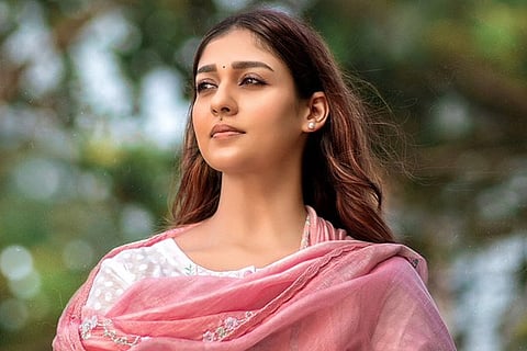 Nayanthara shines bright in the first look poster of her upcoming Malayalam flick 'Nizhal'
