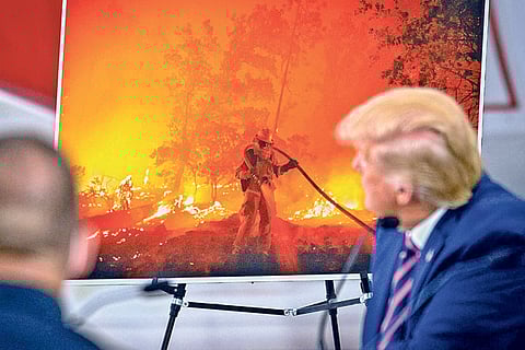 President Trump being briefed on the California wildfires in September
