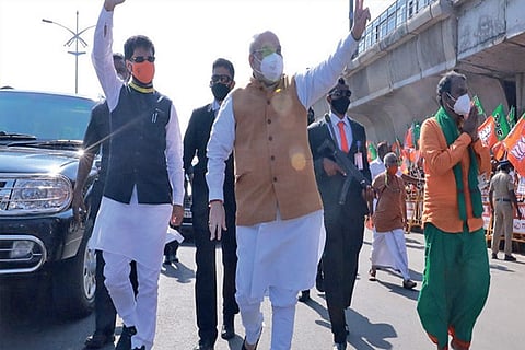 Amit Shah made a suprise walk and greeted BJP cadre and public after landing in city on Saturday