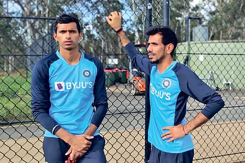 Saini (left) and Chahal have a chat during a training session