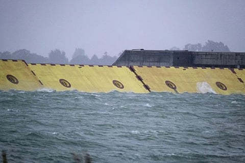 Venice deploys flood barrier for first time as storm drives up tide