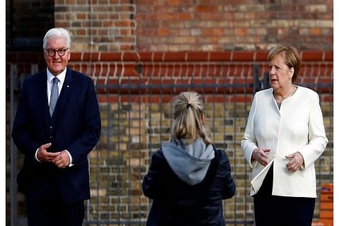 German President Frank-Walter Steinmeier, Chancellor Angela Merkel pose before the start of the fest