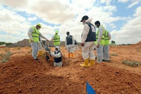 12 bodies recovered in Libya mass graves