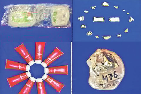 The containers used to conceal the gold (right) and the recovered metal