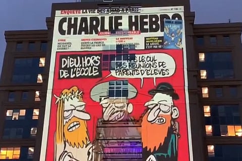 Giant images of Charlie Hebdo cartoons of Prophet Mohammed appear on French govt building