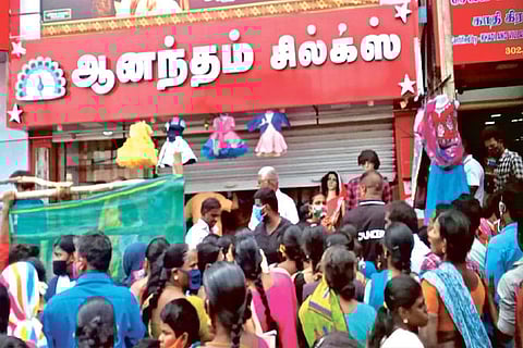 The heavy crowd in front of the textile showroom in Salem on Friday