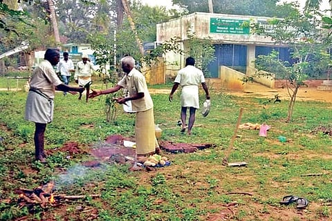 People performing bhoomi puja for new school building in Thulukka Viduthi in Thanjavur on Friday