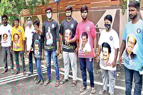 Rajini Makkal Mandram members at Poes Garden urging Superstar to enter politics in Chennai on Friday