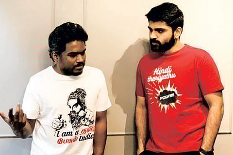 Yuvan Shankar Raja and Metro Shirish wearing the T-shirts