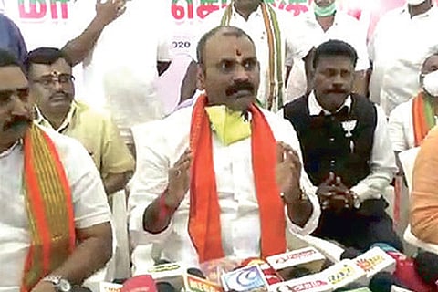 BJP leaders during a press meet on Sunday