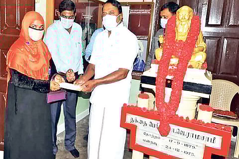 A woman being given educational assistance