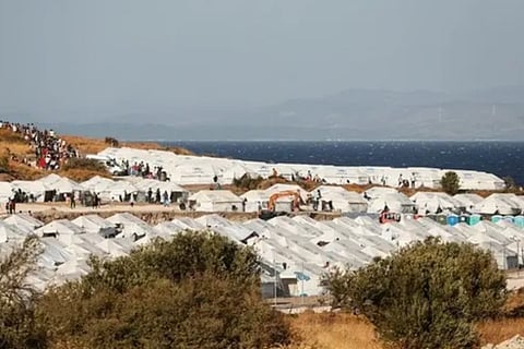 About 9,000 migrants on Greece's Lesbos move into tent camp after fire