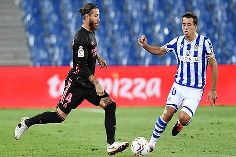 Real Madrid captain Sergio Ramos battles for the ball with Real Sociedad's Mikel Oyarzabal