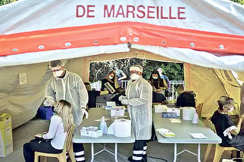 People receive COVID-19 tests at a mobile testing center in Marseille, France