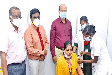 Collector A Shanmuga Sundaram inspecting vaccination drive for bank staff in Vellore on Monday