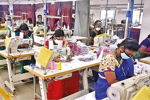 Employees at work in a garment unit in Tirupur. (File picture)
