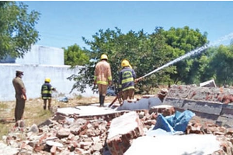 Firemen in action at the cracker unit in Chokkalingapuram, where an explosion occurred on Saturday