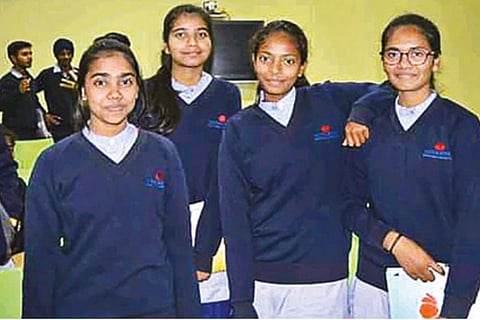 Ansuiya, who scored 100 per cent marks (best of five) in her CBSE Class 12 exams, with her friends