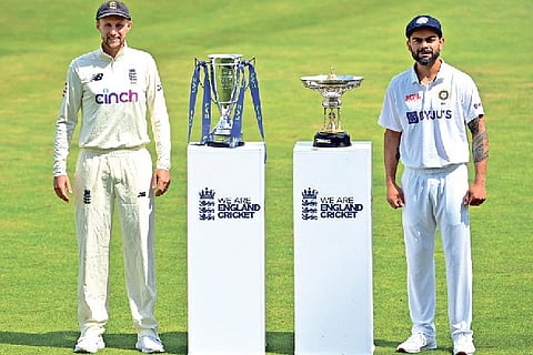 India captain Virat Kohli (right) and England skipper Joe Root pose with the Test series trophies