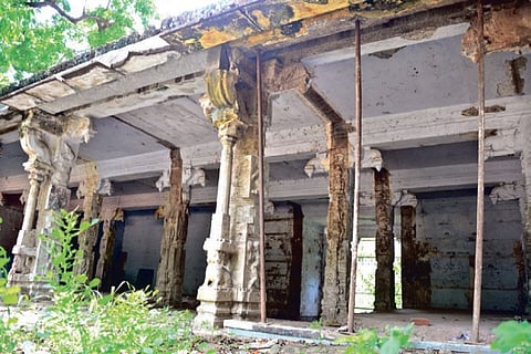 Iron poles erected to prevent the roof of an edifice inside Vellore Fort from crumbling