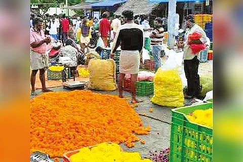 Crowd that thronged Thovalai flower market on Saturday.
