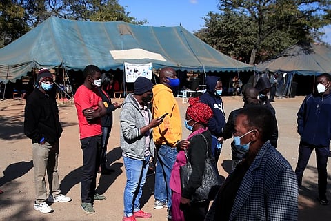 People queue to recieve Covid-19 vaccinations at a clinic in Harare, Zimbabwe (Image credit:Reuters)